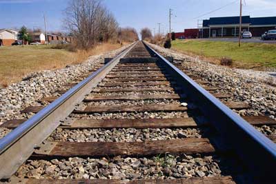 Railroad crossties fastened to a track via rail spikes and tie plates.